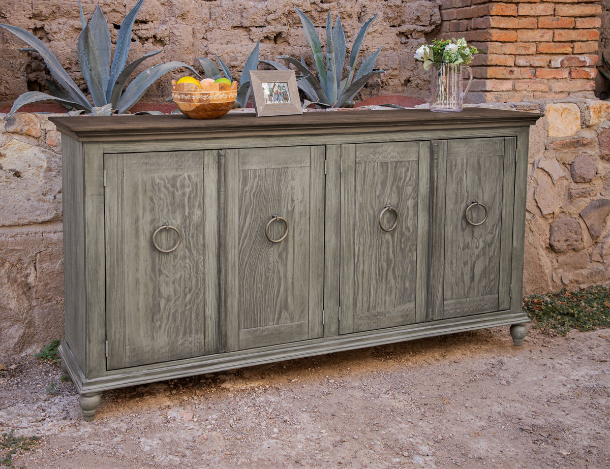 Gray-green distressed wood sideboard with four doors and round pulls